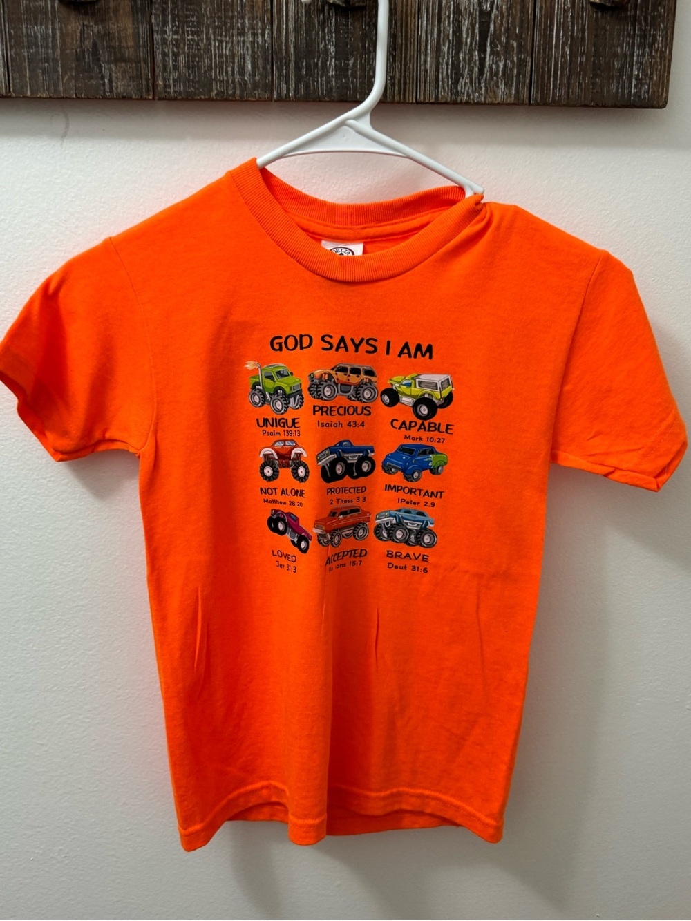 Bright Orange Kids Tee with Colorful Trucks God Sats I Am monster trucks